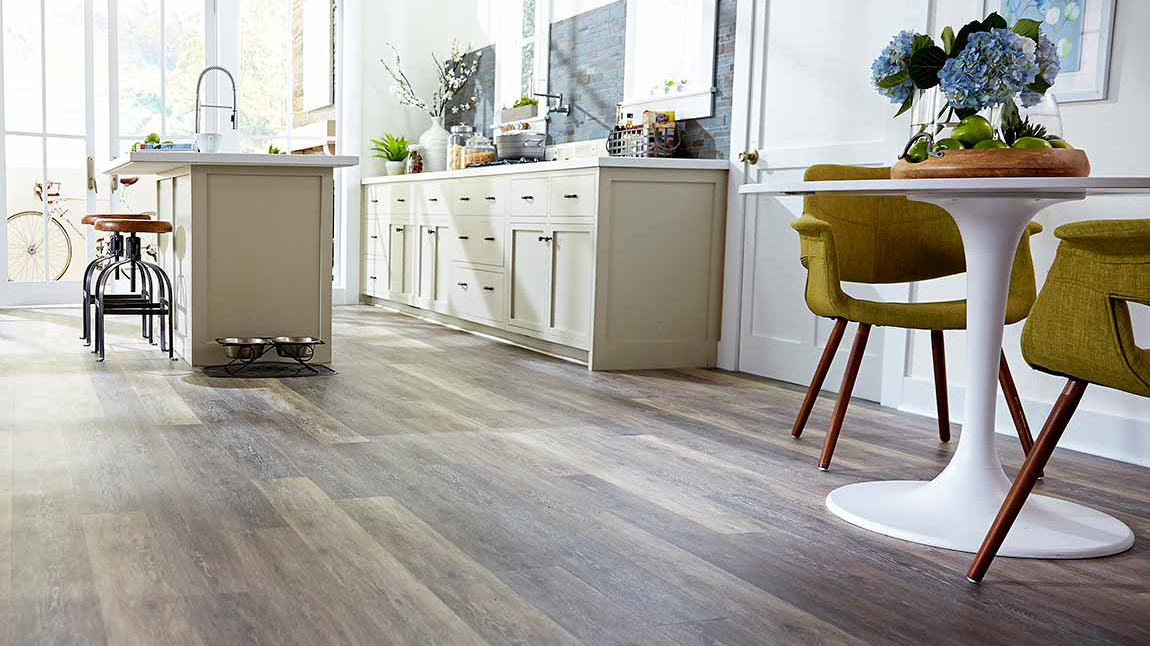 Hardwood flooring in a kitchen, installation services available.