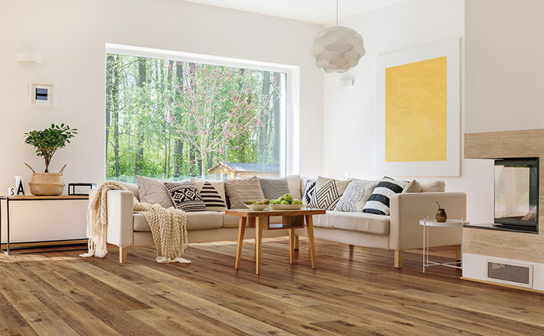 Bright and open cozy living room that has floating floors.