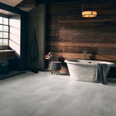 stone look luxury vinyl floors in a rustic bathroom