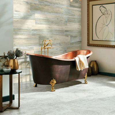 gray tile floors in a stylish Wenatchee bathroom with copper tub